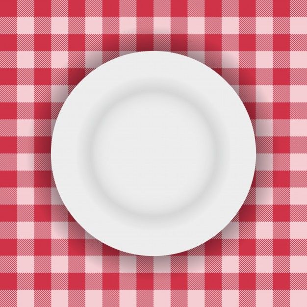 a white plate sitting on top of a red and white checkered table cloth