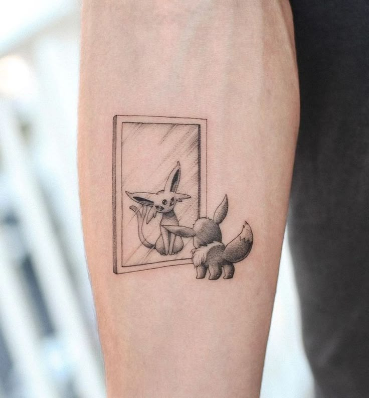 a small tattoo on the arm of a person with a dog looking in a mirror