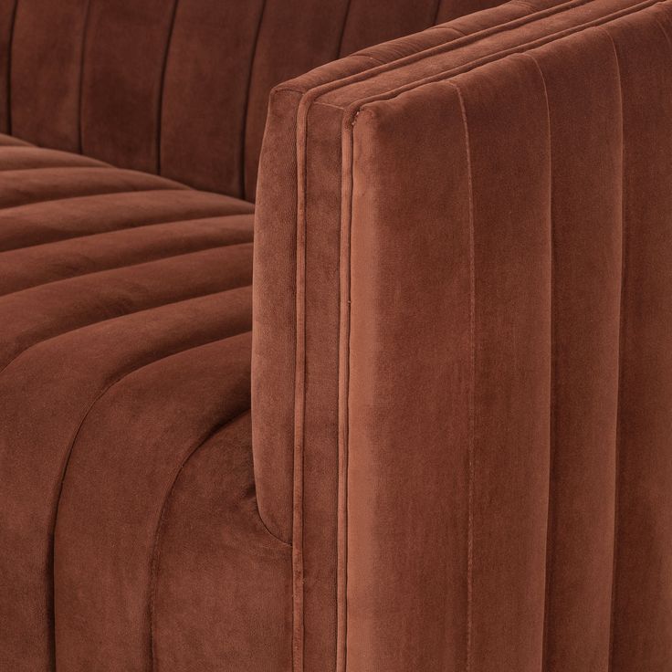 the back end of a brown velvet couch