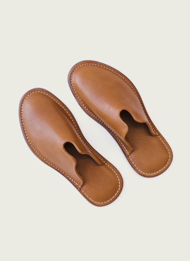 Give a gift to your feet with our Mr. Grumpy slippers. The leather lining and cushioned heel allow for extra comfort - especially as they break in and adjust to the contours of your feet. Great for going outside and yelling at kids to get off your lawn. This is a limited-size run. We suggest sizing up if in doubt. Materials Full-Grain Leather Leather sole with rubber inlay Yelling At Kids, Mr Grumpy, Fun Slippers, Leather Dopp Kit, Best Slippers, Olive Tan, Give A Gift, Leather Slippers, Break In