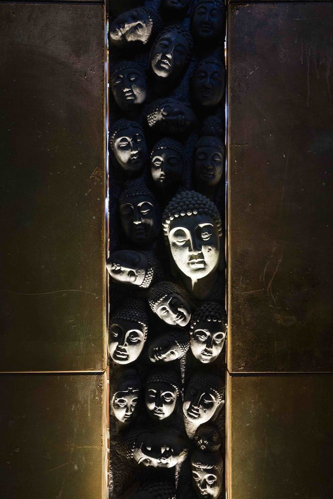 there are many masks on the wall