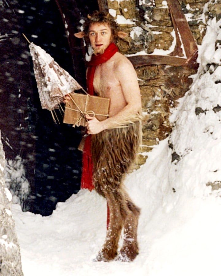 a man dressed as a troll in the snow