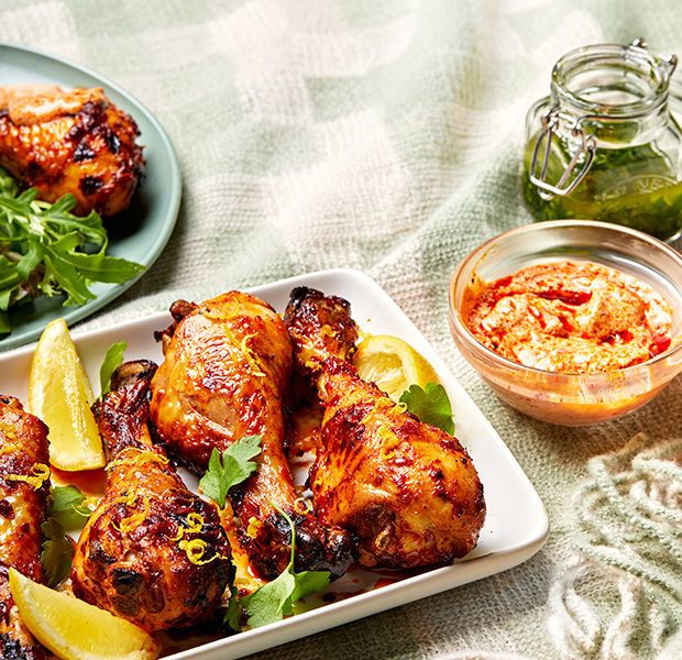 chicken wings with lemon and parsley garnish on a plate