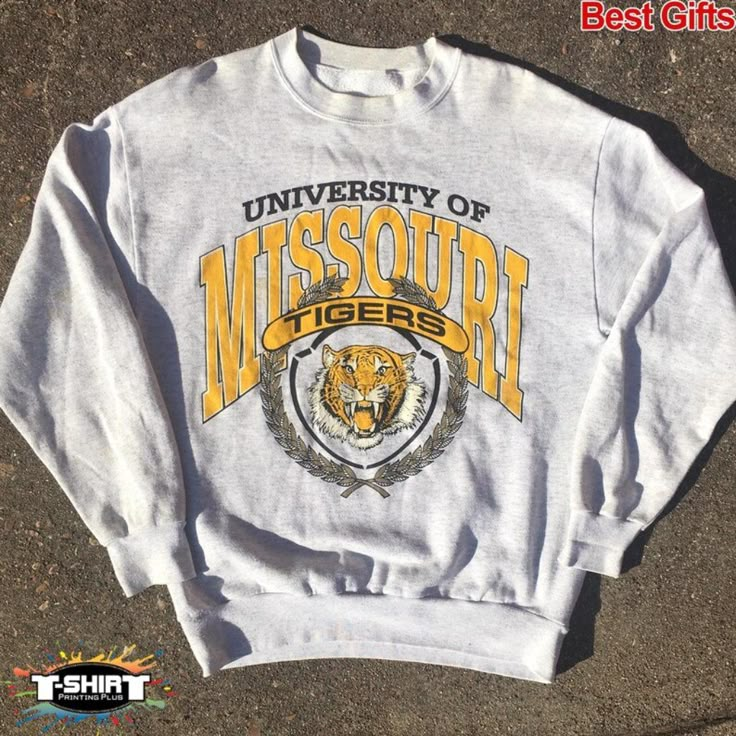 Vintage Ncaa Missouri Tigers Logo Sweatshirt, University Of Missouri Shirt, Ncaa Shirt, Unisex Shirt, Shirt For Man Woman, Vintage Shirt D E T A I L S Unisex Graphic Tee Lightweight, Extremely Comfortable, And Durable Cotton Blend Fabric Machine Wash At 30c. Do Not Tumble Dry. Wash Inside-Out In Cool Water With Similar Colours Using A Gentle Cycle. If Ironing Is Necessary, Iron Inside-Out On The Lowest Setting. Do Not Wash Within 24 Hours Of Receiving. S H I P P I N G Orders Are Shipped As Soon Missouri Tigers Logo, Basketball Tees, Missouri Tigers, University Of Missouri, Football Sweatshirt, Football Tees, Logo Sweatshirt, Vintage Shirt, Long Sleeve Sweatshirts