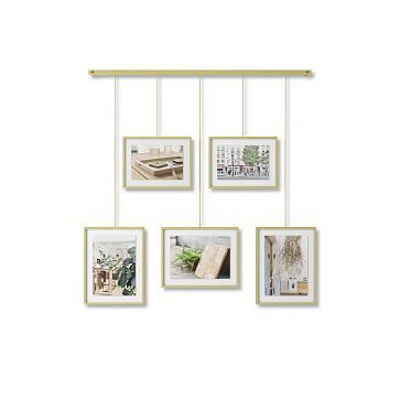 four frames hanging on a wall with different pictures