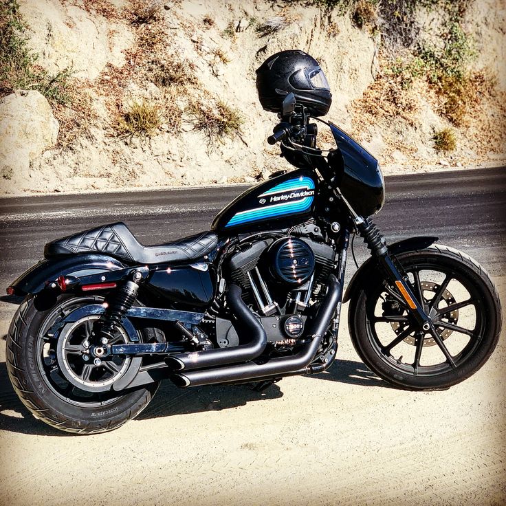 a motorcycle is parked on the side of the road