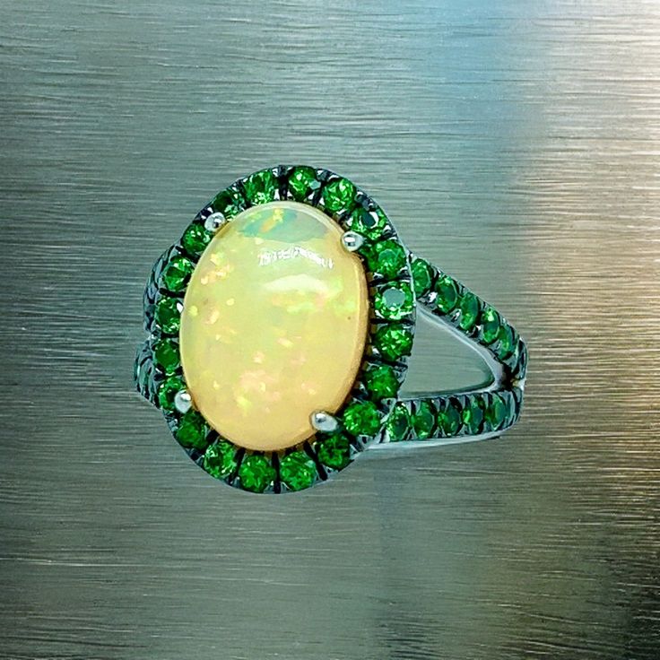 Natural Quality Opal Tsavorite Ring Size 7 14k Gold 5.66 TCW Certified $5,950 300686This is a one of a Kind Unique Custom Made Glamorous Piece of Jewelry!Nothing says, “I Love you” more than Diamonds and Pearls!This item has been Certified, Inspected, and Appraised by Gemological Appraisal LaboratoryGemological Appraisal Laboratory of America is a proud member of:- GIA Alumni Association- National Association of Jewelry Appraisers- International Consortium Gem-Testing Laboratories- Gemological A Oval Green Sapphire Ring With Halo Setting, Oval Multi-stone Tsavorite Rings, Oval Tsavorite Multi-stone Ring, Gia Certified Green Oval Sapphire Ring, Green Tsavorite Gemstone Ring, Green Multi-stone Sapphire Ring For May Birthstone, Green Emerald Cluster Ring With Multi-stones, Green Multi-stone Cluster Ring, Oval Green Tsavorite Jewelry