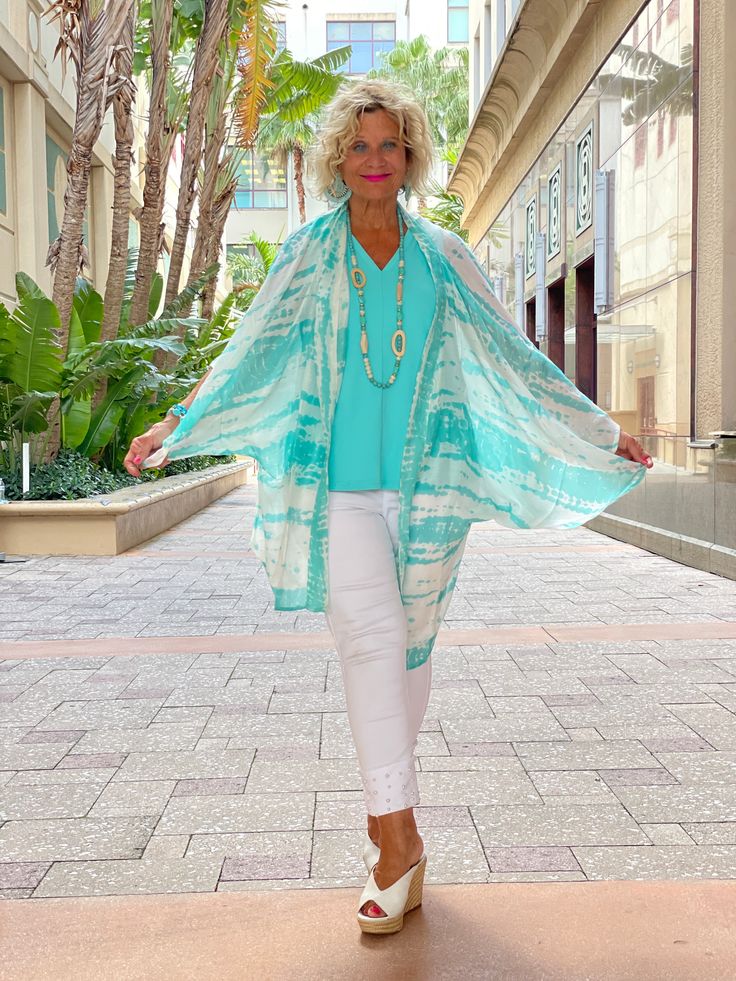 Palmer Kimono: Aqua The one size Palmer kimono in fresh spring colors makes a great addition to any wardrobe. Details & Care: One Size 100% Viscose 35.5" L x 25" W White Wrap Cover-up For Spring, Casual White Spring Kimono, Casual White Kimono For Spring, Spring Daywear Wrap Kimono, Spring Wrap Kimono For Daywear, Blue Kimono For Daywear In Spring, Blue Kimono For Spring Daywear, Blue Spring Kimono For Daywear, Green Kimono Beach Cover-up