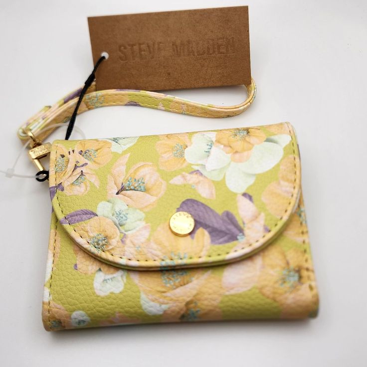 Steve Madden Floral Wallet Nwt Pebbled Pu Leather Magnetic Closure Detachable Wrist Strap Gold Tone Monogrammed Hardware 4 Card Slots Id Window Slot 2 Interior Pockets Exterior Zip Pocket Cash Pocket 5"X 4"X 1" Trendy Yellow Wallet For Daily Use, Yellow Travel Coin Purse With Card Slots, Trendy Yellow Wallets For Everyday Use, Travel-friendly Yellow Coin Purse With Card Slots, Trendy Yellow Wallet For Everyday Use, Yellow Pouch Coin Purse For Travel, Yellow Coin Purse For Everyday Use, Yellow Rectangular Wallet With Removable Pouch, Yellow Pouch Wallet For Everyday Use