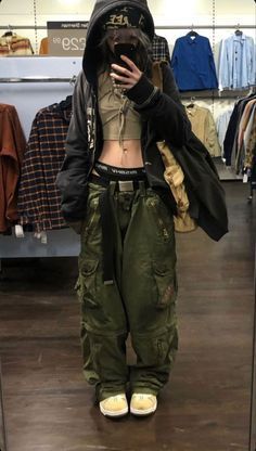 a person taking a selfie in a clothing store