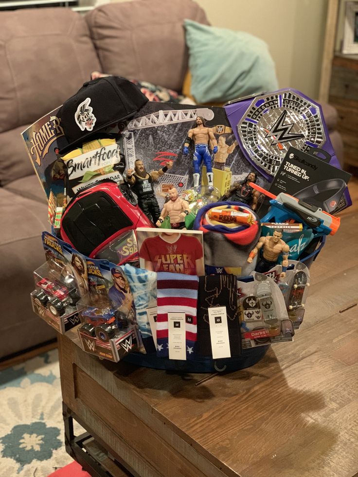 a gift basket sitting on top of a coffee table filled with toys and other items