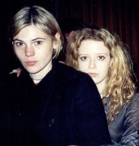 two young women sitting next to each other