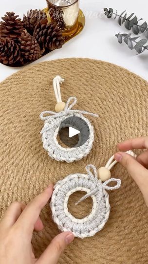 someone is crocheting some ornaments on top of a table