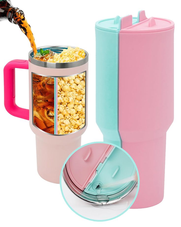 a pink and blue coffee cup next to a mug filled with popcorn