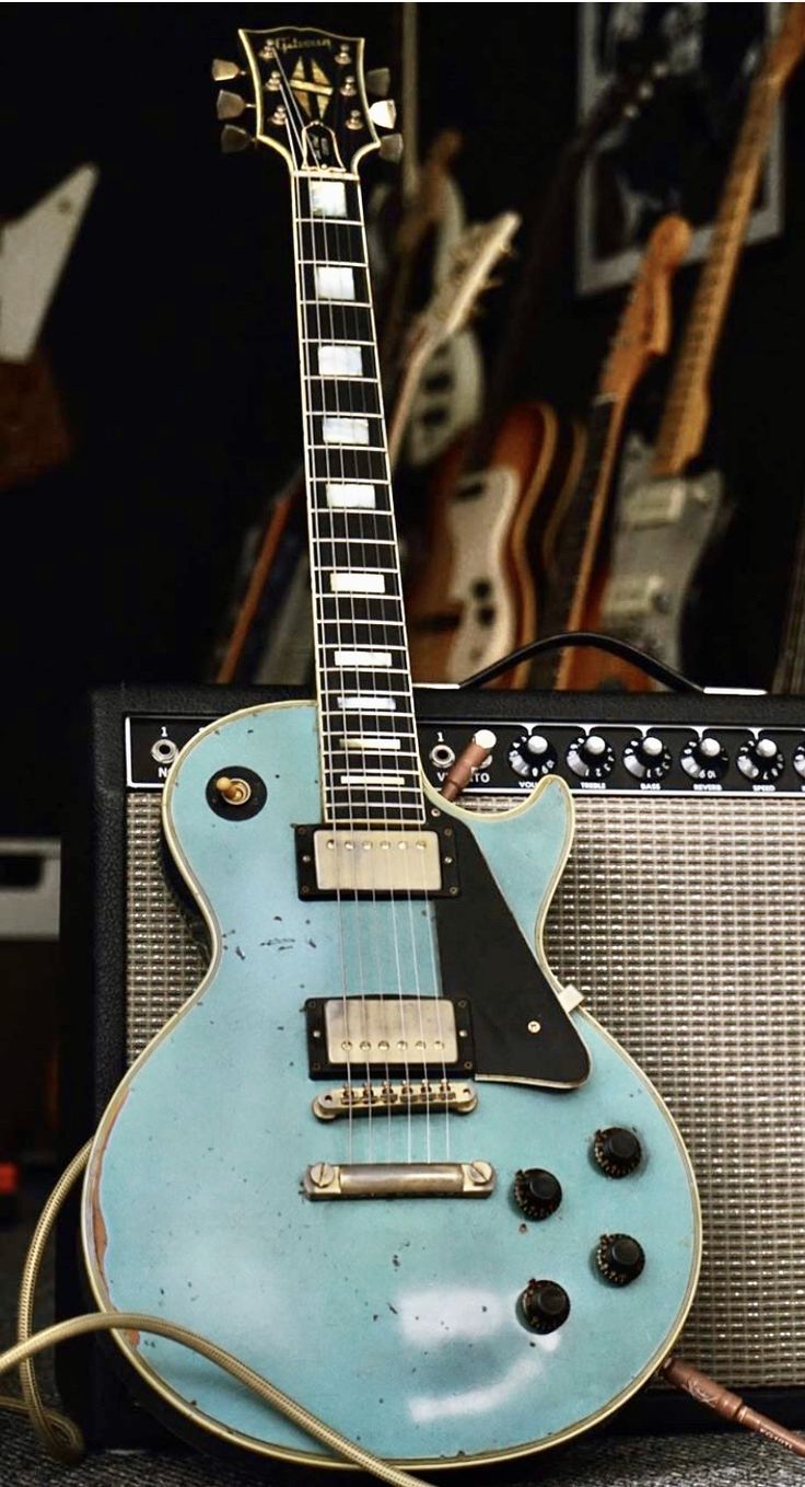 an electric guitar sitting on top of a table