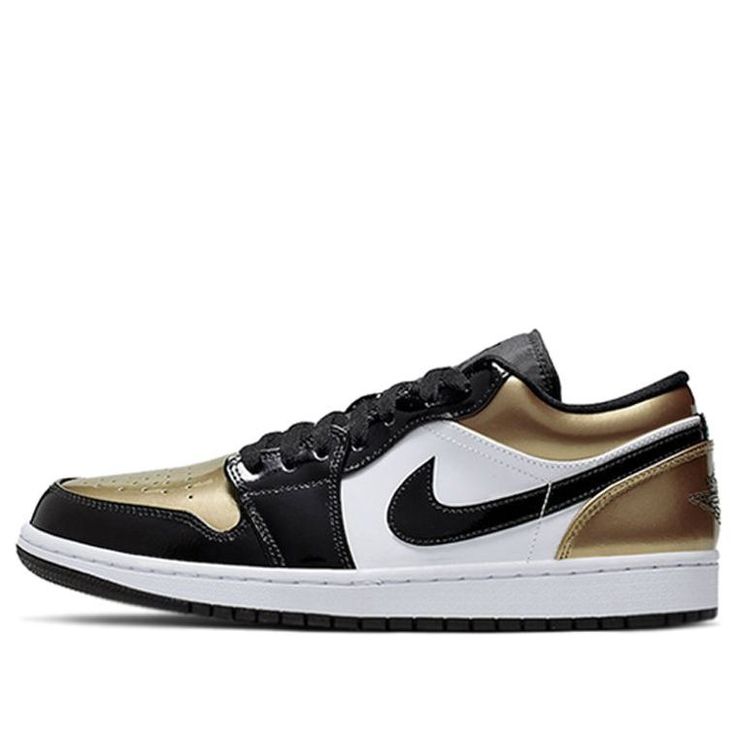 Step up your shoe game with the Air Jordan 1 Low 'Gold Toe.' This summer-ready colorway features a metallic gold upper, white midsole and black outsole. Black branding and a clean white Swoosh give this sneaker a classic look, while the Wings logo on the heel adds some signature Michael Jordan flair. Whether you're hitting the courts or just hanging out, these sneakers will have you looking your best. Gold Sneakers With Contrast Sole For Streetwear, Sporty Custom Gold Leather Sneakers, Sporty Gold Leather Custom Sneakers, Gold Low-top Sneakers With Contrast Sole, Gold High-top Sneakers With Contrast Sole, Gold Leather Custom Sneakers For Streetwear, Sporty Gold Sneakers For Streetwear, Gold Leather Sporty Sneakers, Gold Leather Sneakers For Streetwear