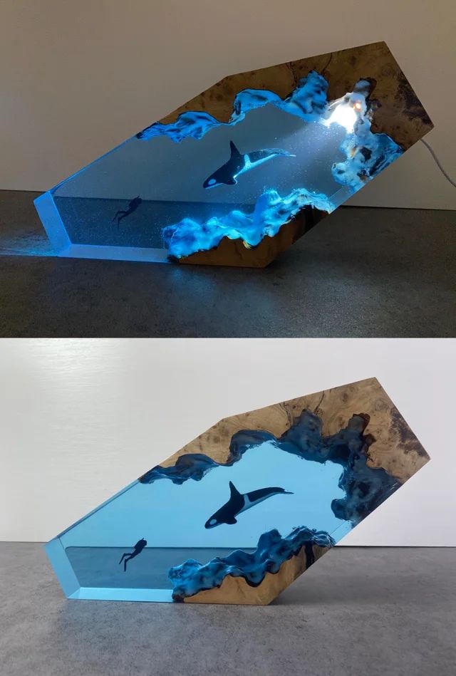 two different views of an art piece with blue lights