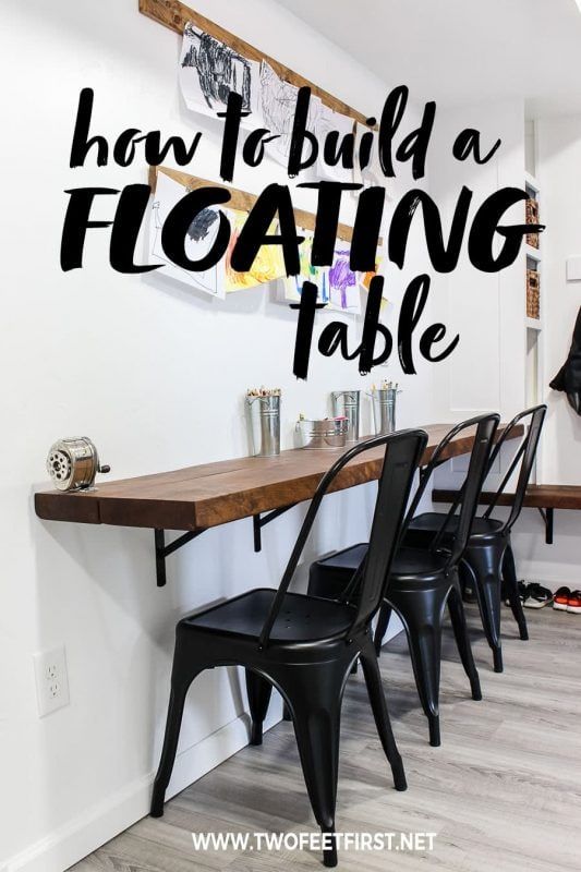 there is a long table with black chairs in the center and an inscription over it that says how to build a floating table