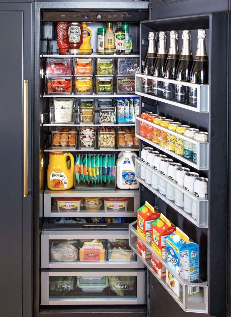 an open refrigerator filled with lots of food and drinks