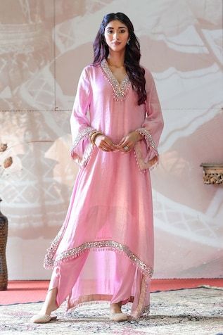 Pink kaftan high low kaftan kurta with mirror embroidery and tassel details. Paired with an inner and dhoti pant. - Aza Fashions Bollywood Style Gota Work Kaftan For Eid, Anarkali Kaftan For Diwali Reception, Eid Reception Kaftan With Sheer Dupatta, Festive Harem Kurta For Eid, Festive Eid Harem Kurta, Bollywood Style Harem Kurta For Navratri, Bollywood Style Harem Kurta For Festive Occasions, Bollywood Harem Kurta For Navratri, Festive Harem Kurta For Navratri