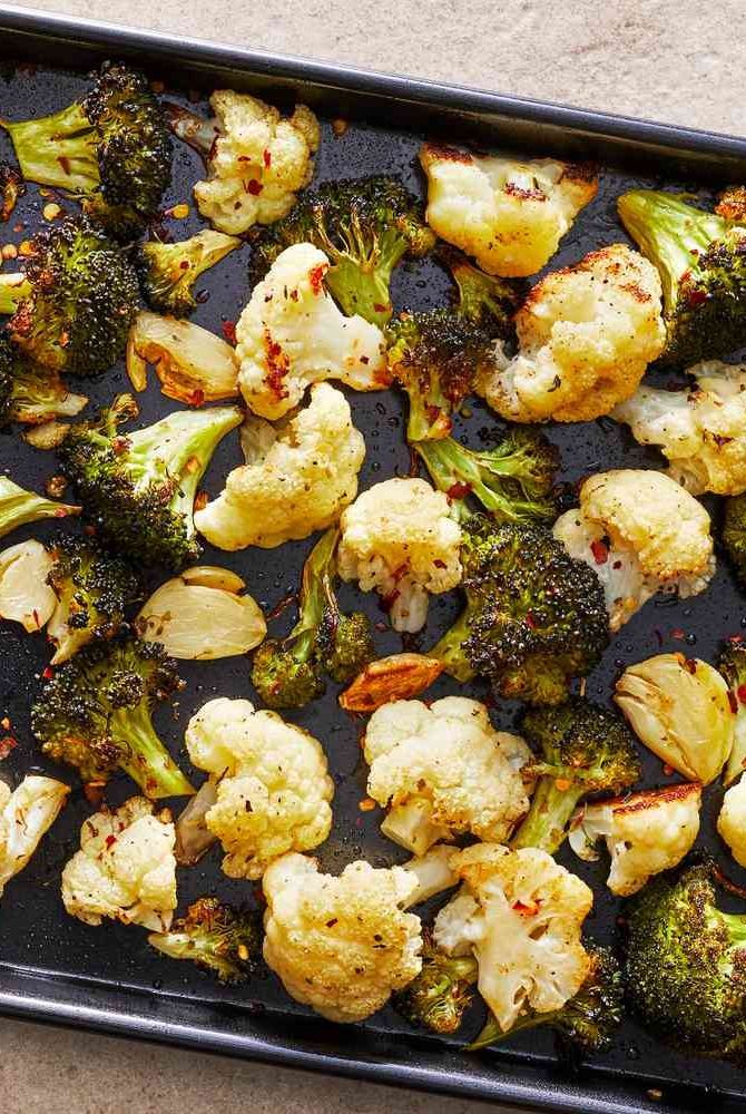 roasted cauliflower and broccoli on a baking sheet