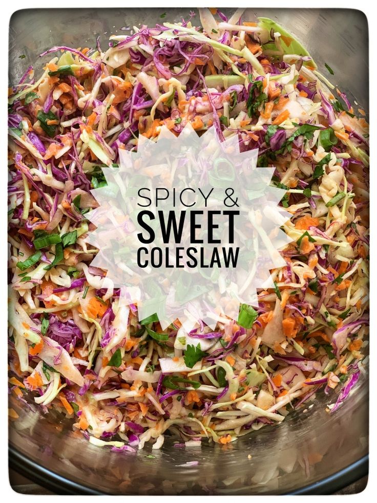 a bowl filled with coleslaw slaw next to a sign that says spicy and sweet coleslaw