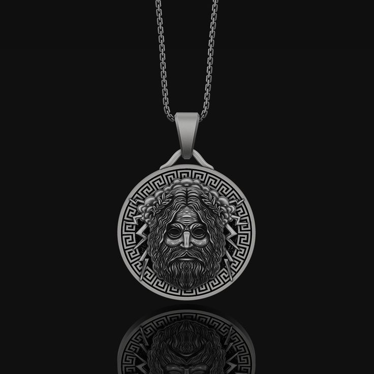 Silver Zeus Men's Oxidized Finish Mythological Style Round Jewelry Gift, Ancient Style Engraved Jewelry Gift, Etched Stainless Steel Silver Jewelry, Spiritual White Gold Jewelry With Box Chain, Symbolic Sterling Silver Coin Pendant Jewelry, Silver Necklace With Round Pendant In Vintage Style, Engraved Stainless Steel Medallion Jewelry, Symbolic White Gold Jewelry With Box Chain, Spiritual Stainless Steel Jewelry With Oxidized Finish