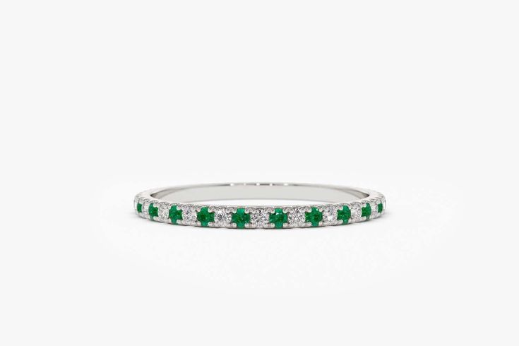 "Emerald and Diamond Eternity Band/ 14k Yellow Gold 1.5MM Micro Pave Diamond and Emerald Eternity Wedding Ring/ Emerald Wedding Band Features *Made to Order *Material: 14K Solid Gold (If 18K is needed, please inquire) * Gold Color Choice: Rose Gold, Yellow Gold, White Gold *Gemstone Cut: Round *Gemstone: White Diamonds and Emeralds * Diamond Color: G Color * Diamond Clarity: SI (TRUE SI) *Setting Type: U Setting Micro Pave *Number of Stones: 52 (varies by size of the ring) *Stone Size: 1.15MM *T Green Round Cut Eternity Band For Wedding, Green Round Cut Wedding Eternity Band, Wedding Eternity Band With Halo In White Gold, White Gold Halo Eternity Band For Wedding, Wedding White Gold Eternity Band With Halo, Wedding White Gold Halo Eternity Band, 14k White Gold Eternity Band For Wedding, 14k White Gold Wedding Eternity Band, Wedding Ring Emerald