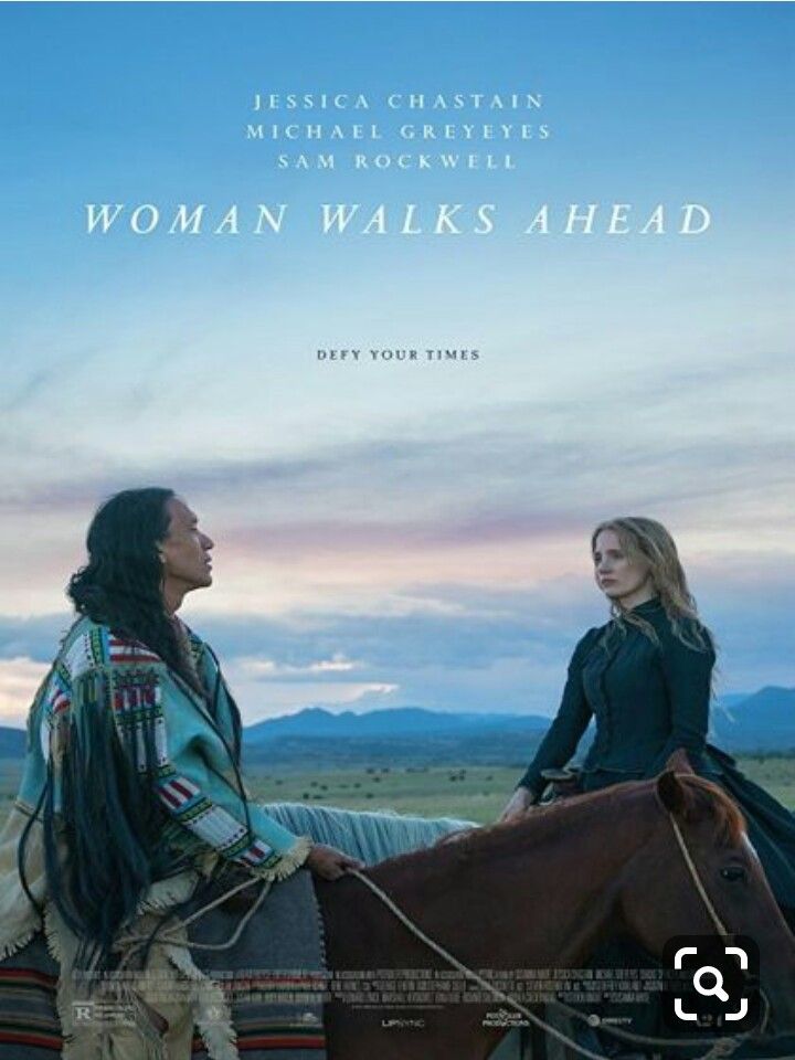 the poster for woman walks ahead shows two women sitting on horses, facing each other