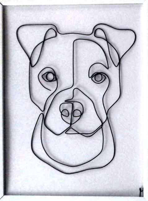 a drawing of a dog's face is shown in a white frame with black lines