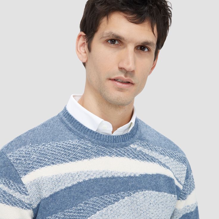 This luxe wool-cotton sweater blends style with comfort. Its mixed stitch creates depth with a captivating ripple pattern. Ideal for all seasons, it offers wool's warmth and breathability with cotton's softness and durability. Ribbed crew neck, cuffs, and hem ensure a snug fit, perfect for casual or refined looks. Blue Textured Knit Wool Sweater, Casual Blue Merino Wool Sweater, Casual Merino Wool Jacquard Knit Sweater, Ripple Pattern, Blazer And T Shirt, Vest Blazer, Vacation Resorts, Fashion Socks, Printed Sweater