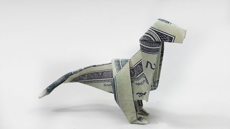 an origami man made out of one dollar bill