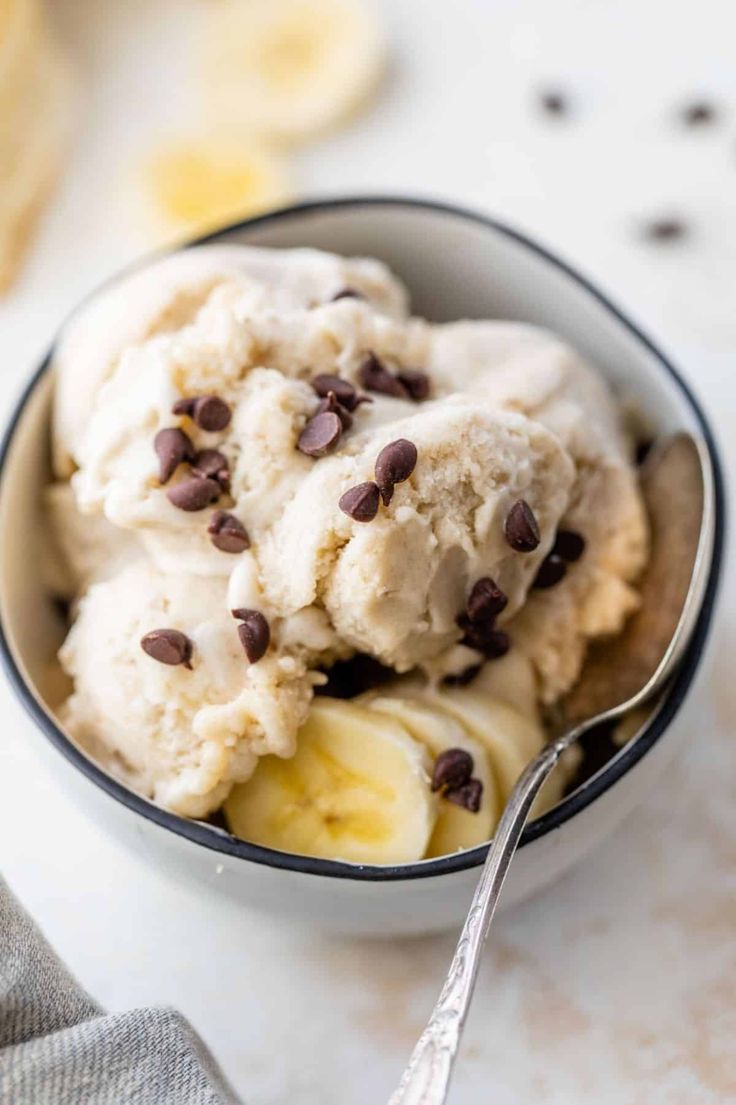 a bowl filled with ice cream and chocolate chips