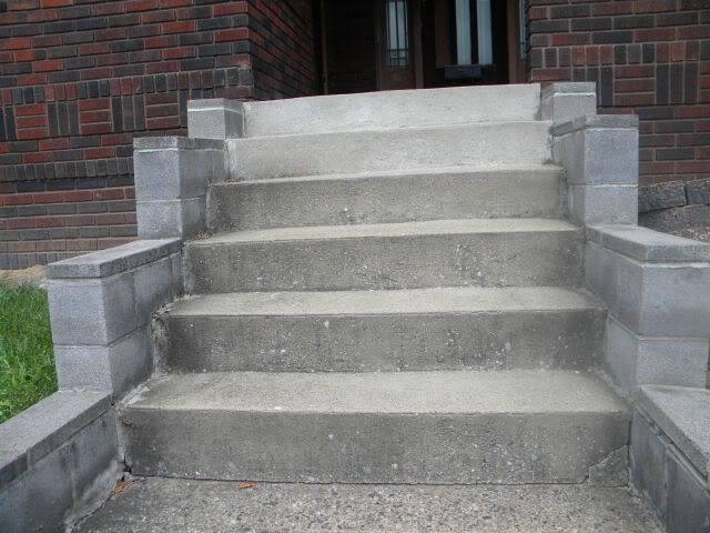 concrete steps leading up to a brick building