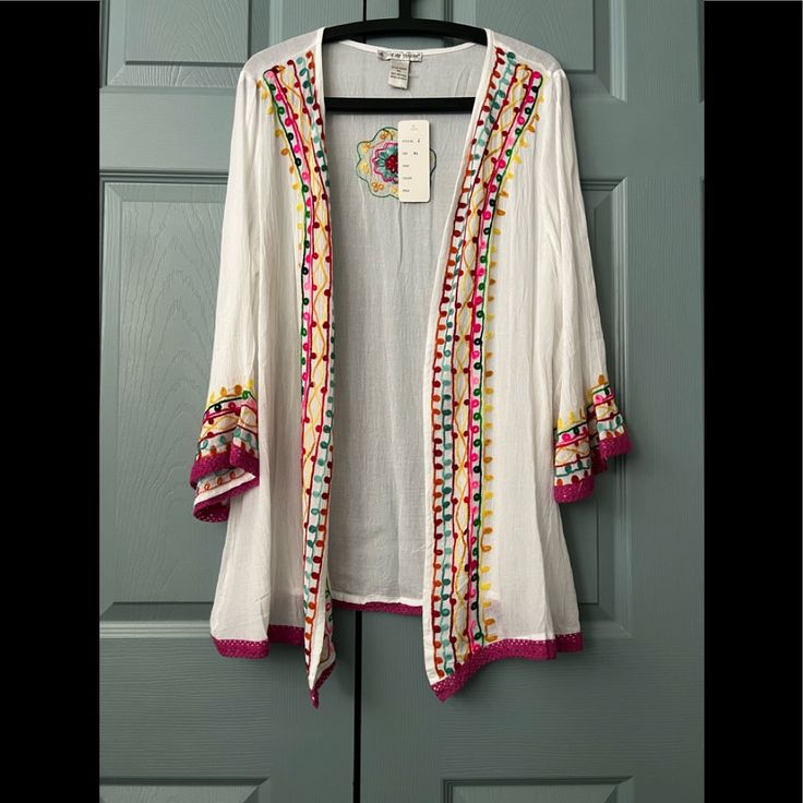 This Pretty Light Weight Cardigan Can Be Worn With A Favorite Blouse, Or With Your Bathing Suit. Material Is 100% Rayon. Casual Long Sleeve Cardigan With Floral Embroidery, Spring Floral Embroidered Long Sleeve Cardigan, Long Sleeve Floral Embroidered Cardigan For Spring, Pink Floral Embroidery Cardigan For Spring, Casual Cotton Cardigan With Floral Embroidery, Pink Embroidered Long Sleeve Cardigan, White Embroidered V-neck Cardigan, Spring Embroidered White Cardigan, Spring Casual Embroidered Cardigan