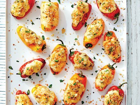 stuffed peppers with cheese and herbs on a white tray