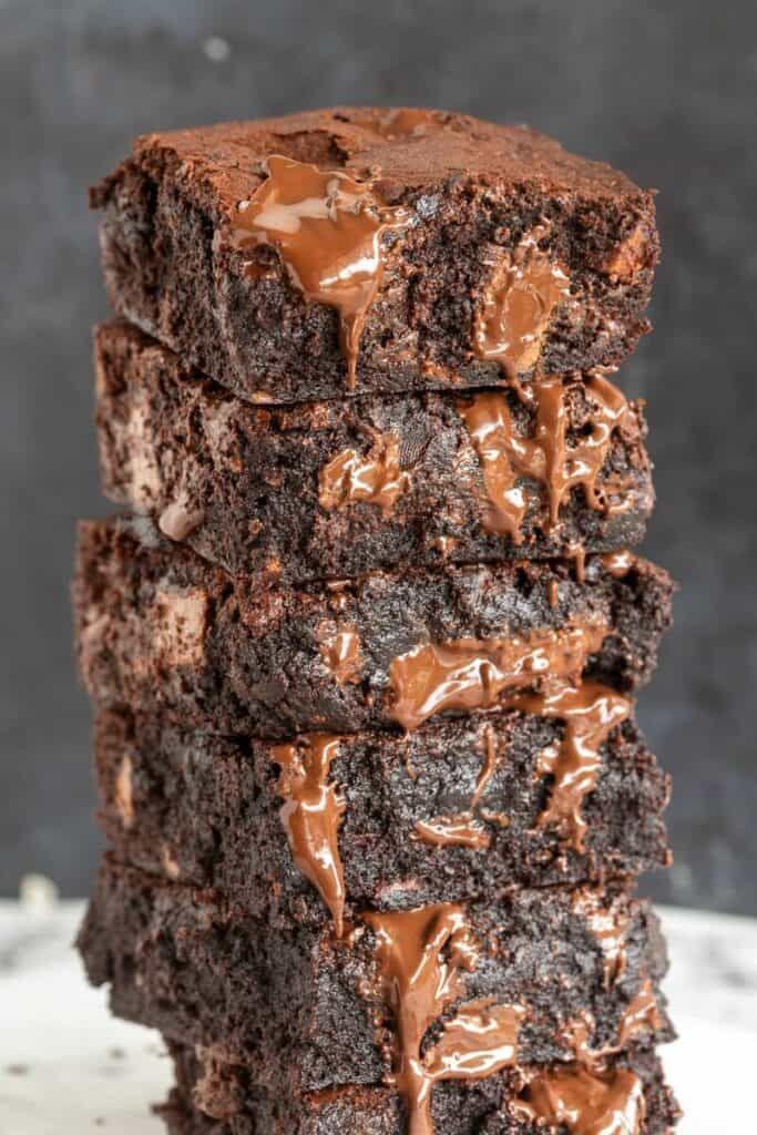 four chocolate brownies stacked on top of each other