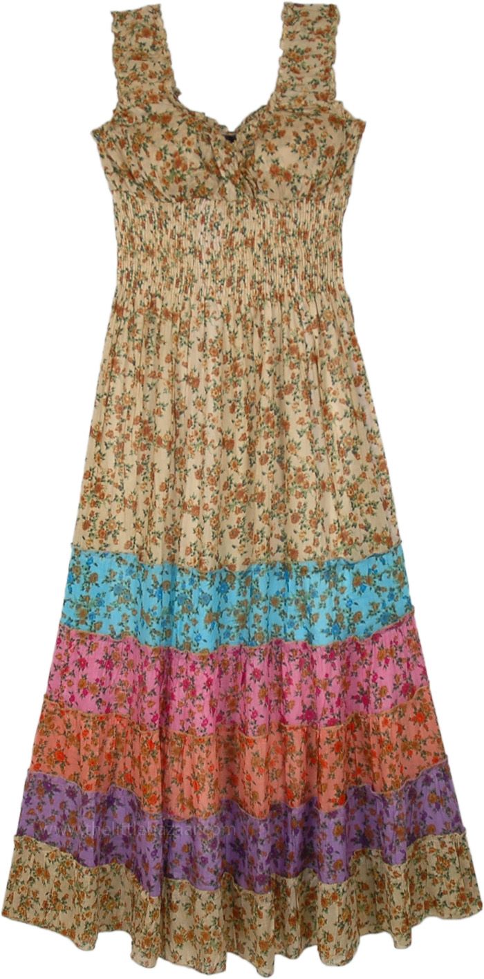 An exquisite bohemian summer wear sleeveless fit and flare long dress in beige with multicolored tiers at the bottom.  This sleeveless V-neck dress features a wide smocked elastic waist top part and a flowing skirt like tiered bottom half. #tlb #Sleeveless #vacationclothing #beachwrap #Floral #Printed #bohemianfashion #Longcottondress #sleevelessdress #floraltiereddress Flare Long Dress, Long Cotton Dress, Hippy Dress, Dresses Beige, Kashmiri Embroidery, Sleeveless Cotton Dress, Beach Floral, Cotton Voile Fabric, Cotton Long Dress