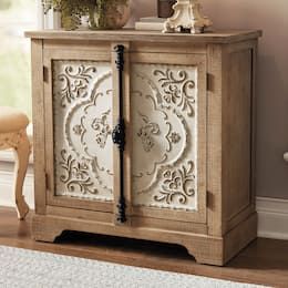 a wooden cabinet with ornate carvings on the doors and drawers is shown in front of a window