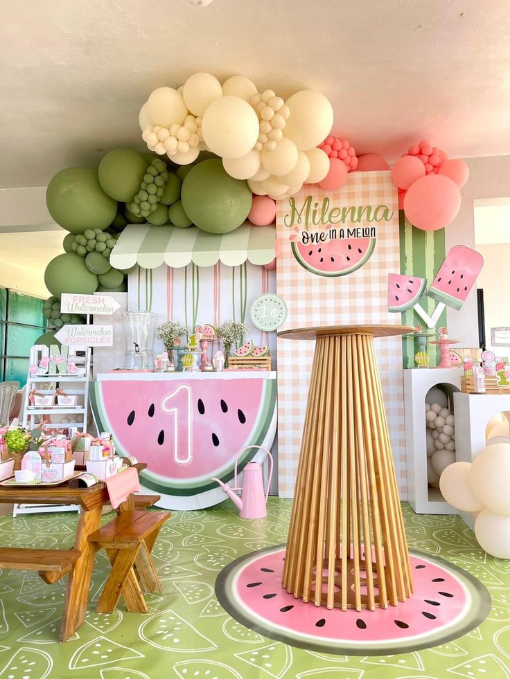 a watermelon themed birthday party with balloons