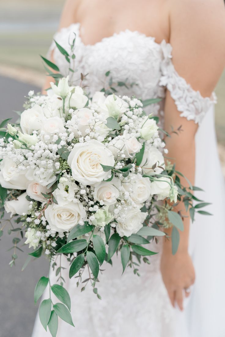 White Rose, Italian Ruscus, Baby's Breath and Seeded Eucalyptus Bridal Bouquet

-Cassidy Alane Photography Wedding Buqet Flowers White, White Bouquet With Eucalyptus, White Rose Eucalyptus Babys Breath Bouquet, White Bride Bouquet With Greenery, White Rose Wedding Bouquet With Greenery, Bridal Bouquet White Roses Eucalyptus, White Roses With Eucalyptus Bouquet, Bridal White Rose Bouquet, Wedding Flower Bouquets Bridal White Roses