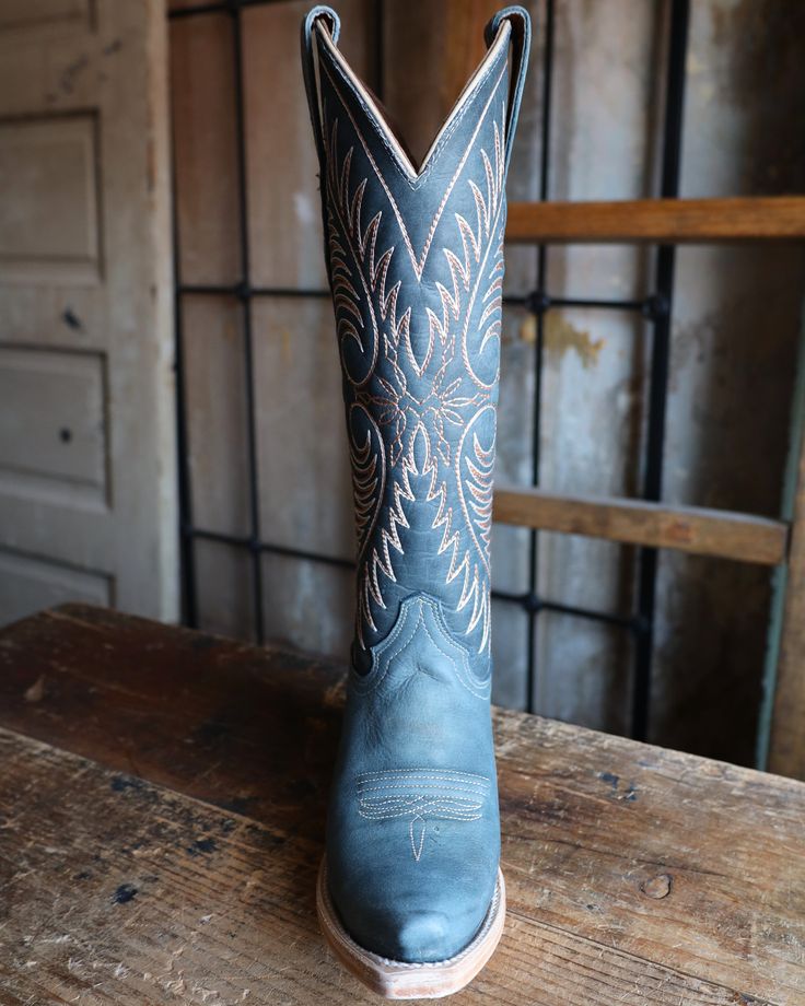 Product Info: Blue leather upper & foot. Peach & white western embroidery on shaft. 14 inch shaft height. Pig lining. Pull tabs for easy on. Snip toe shape. Goodyear welt construction. Cushioned leather insole. Leather outsole. Cowboy heel type. 2 inch heel type. Womens Western Shoes, Teal Cowgirl Boots Outfit, Western Blue Wedding, Blue Tecovas, Blue Cowgirl Boots Outfit, Western Style Light Blue Round Toe Boots, Western Style Blue Boots With Square Toe, Western Style Blue Leather Heeled Boots, Western Style Blue Boots With Reinforced Heel