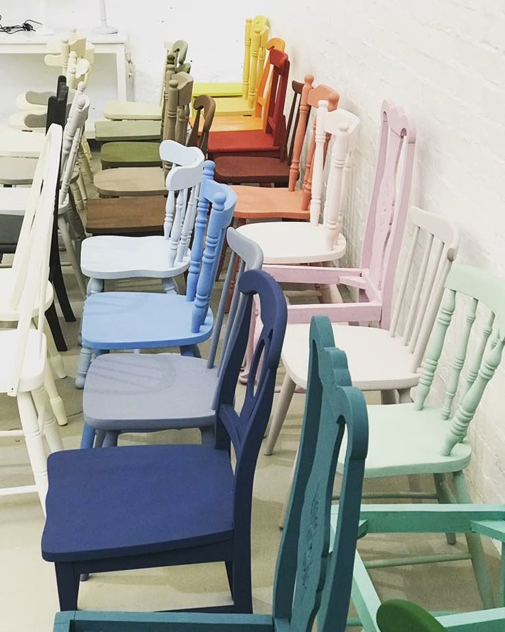 a row of colorful chairs sitting next to each other