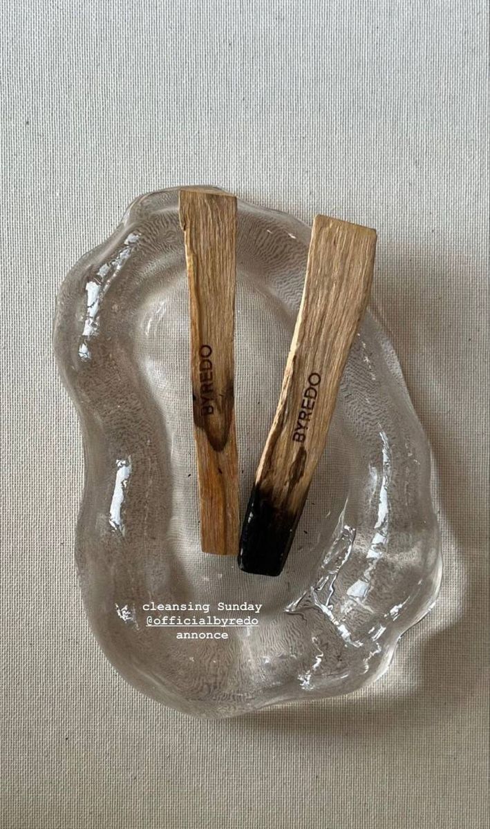 two wooden sticks sticking out of an ice - like object