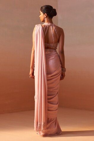 Blush pink sleeveless halter neck blouse with 3D flora, resham and stone embellishments. Paired with an embroidered waistband pre-draped shimmer satin saree. - Aza Fashions Halter Neck Blouse, Dhoti Saree, Cotton Sarees Handloom, Saree Women, Halter Neck Blouses, Satin Embroidery, Embroidery 3d, Saree For Women, Drape Saree