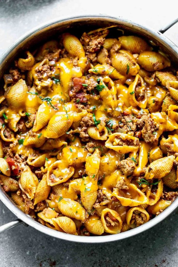 a pot filled with pasta and ground beef