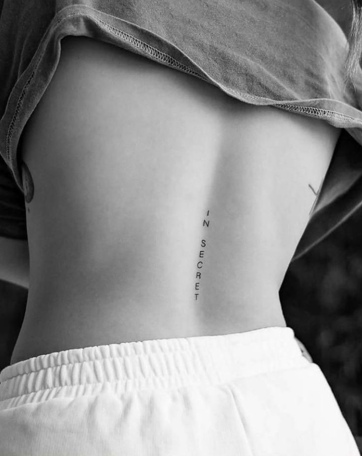 a woman's lower back tattoo with the words no matter