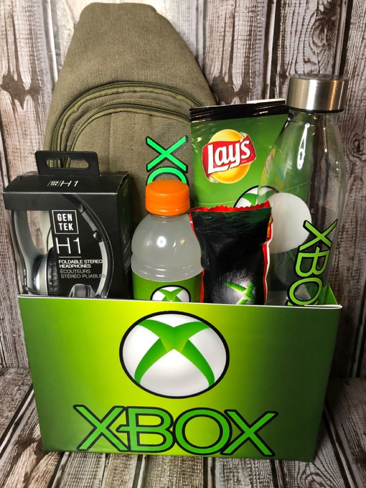 the xbox box is packed with drinks, snacks, and other things to pack in it