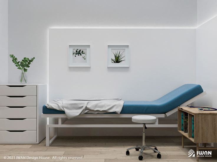 a hospital room with a bed, dresser and plant on the wall next to it