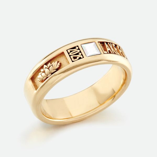 a gold ring with the word love written in two different languages on it and flowers